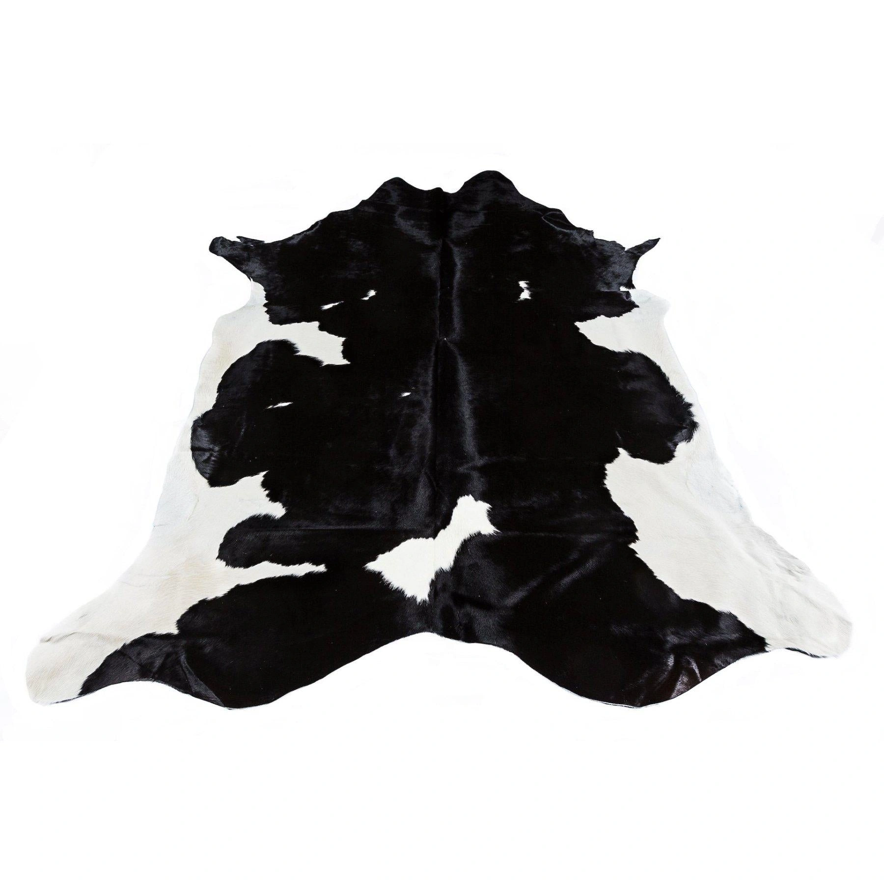 Friesian Black Cowhide Rug: Striking Black & White Beauty - Luxurious & Durable.